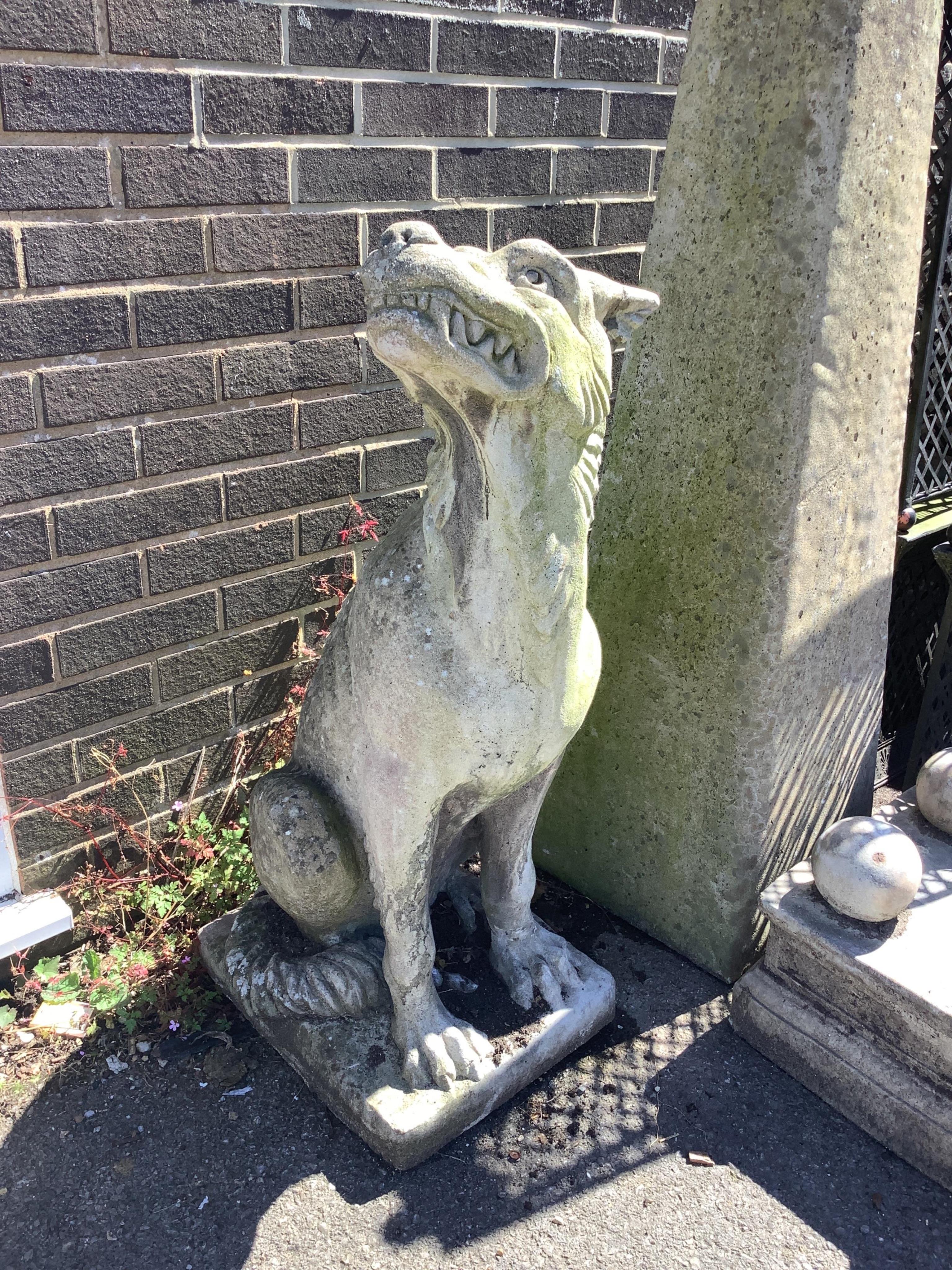 A reconstituted stone gargoyle garden ornament, height 100cm. Condition - fair